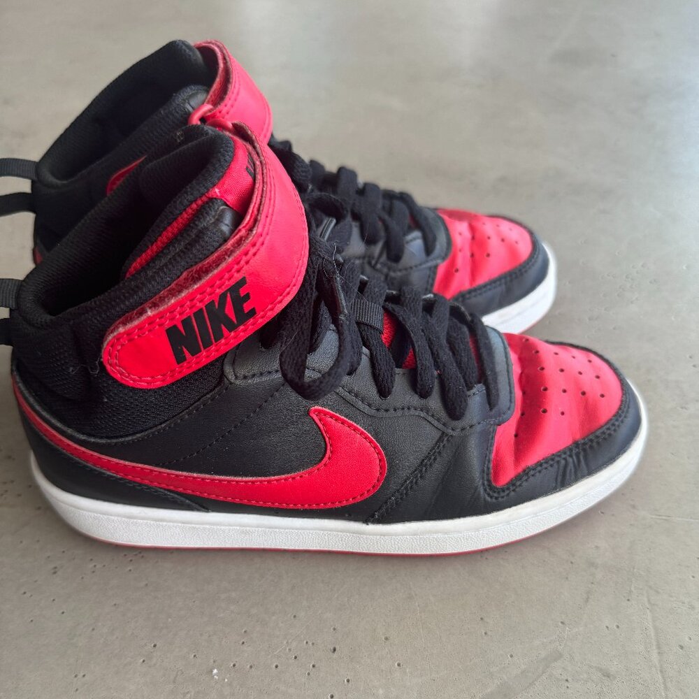 Boys black and red Nike high tops